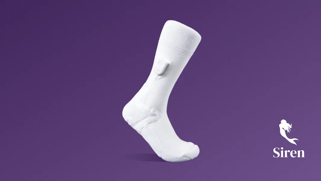 White sock with a small device attached to the ankle on a purple background next to a white Feetwings logo and the word 'Siren'.
